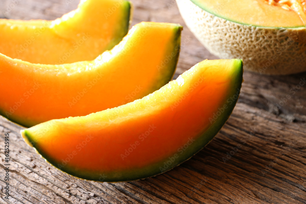melons sliced Fresh on wooden table melons sliced Fresh on wooden table