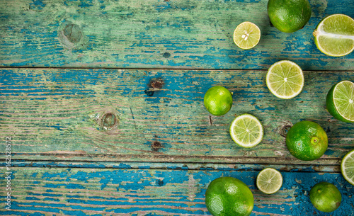 Fresh limes cut in half on ...