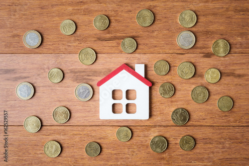 Top view of house model and Euro coins photo