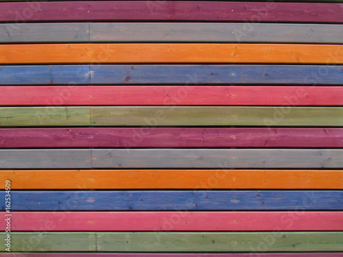 Texture of wooden planks, bright painted wall