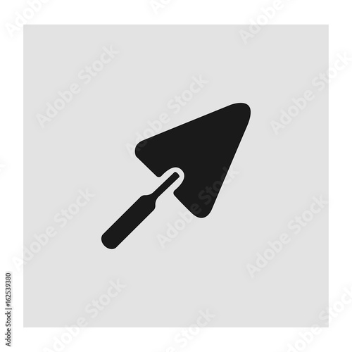 Black trowel icon on a grey background. Vector illustration
