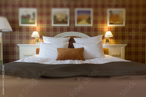 Hotel room - bed with pillo...