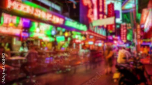 Soi Cowboy red light district in Bangkok, Thailand at night, timelapse (blurred for commercial use)