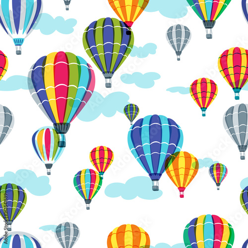 Vector seamless pattern with colorful hot air balloons in the sky. Hand drawn doodle illustration. Summer design for fabric and fashion textile print.
