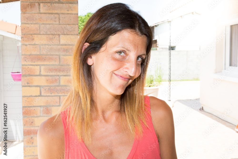 smiling woman in summer happy at home smiling woman in summer happy at home