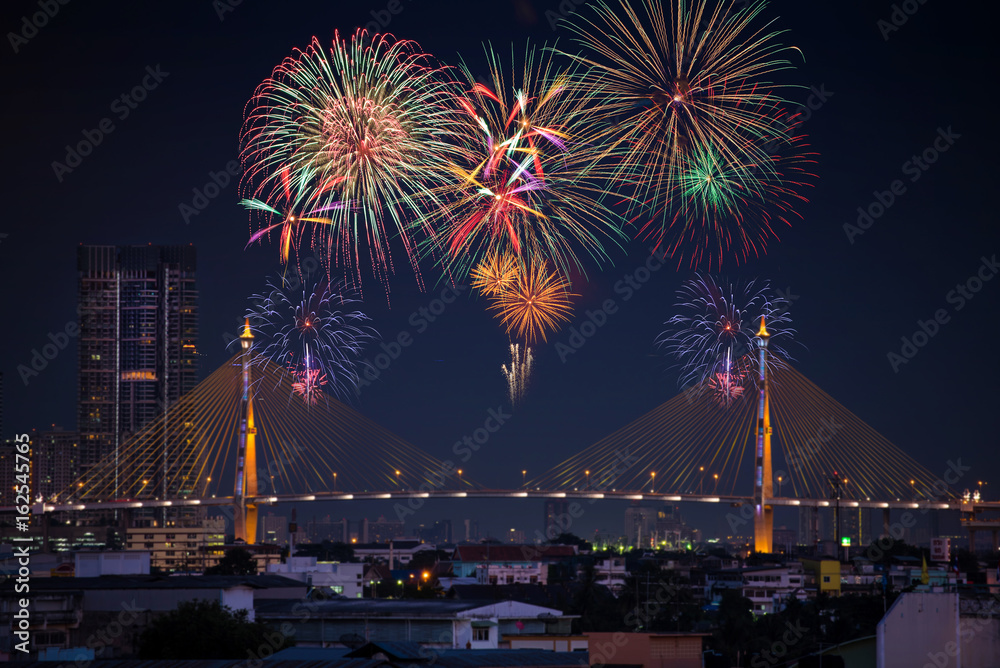 Beautiful firework display on celebration night, showing on the river Beautiful firework display on celebration night, showing on the river