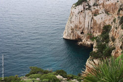 Aerial view of a cliff overlooking the sea in Sardinia 