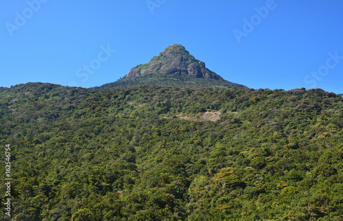 Adam's Peak (known as Sri Pada) sacred mountain in Sri Lanka on the background of blue sky