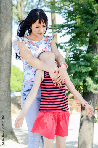 Mother and girl enjoy the freedom