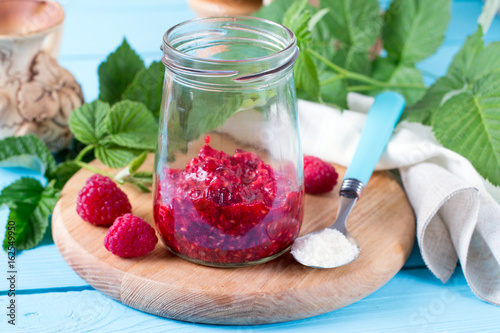 Fresh raspberries in a jar photo
