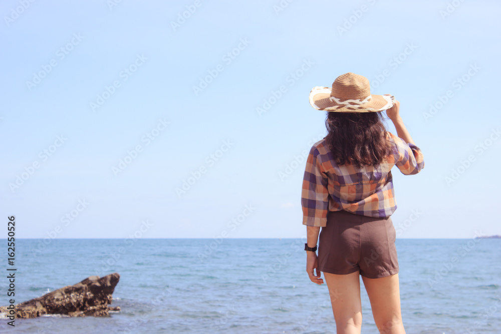 Beautiful girl in vacation time at sea. Soft light, Soft focus. Pastel or Vintage style.