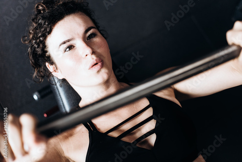 Flexible young woman train in the gym