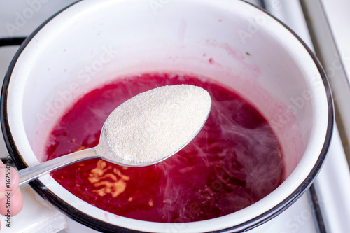 Strawberry jam making photo