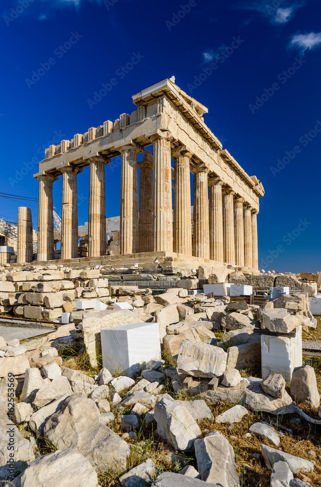 Parthenon temple on a bright day. Acropolis in Athens, a popular tourist destination and historical landmark in Greece.
