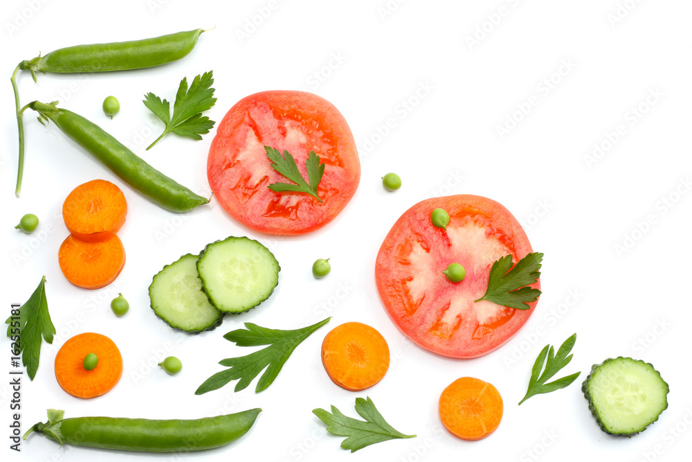 sliced tomatoes, sliced carrot, sliced cucumber, parsley and fresh green peas isolated on a white background. top view sliced tomatoes, sliced carrot, sliced cucumber, parsley and fresh green peas isolated on a white background. top view
