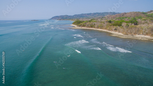 Aerial view of a surfer on a wave in Santa Teresa, Costa Rica