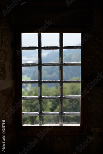 Old Window with a iron grid