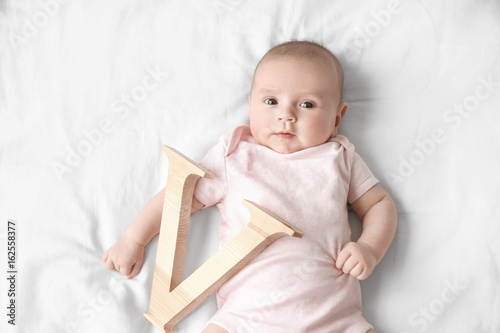 Cute baby with letter V lyi...
