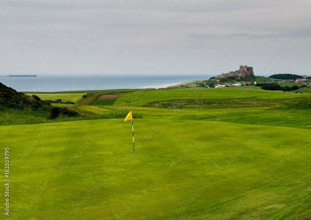 View of Bamburgh Castle over 16th green
