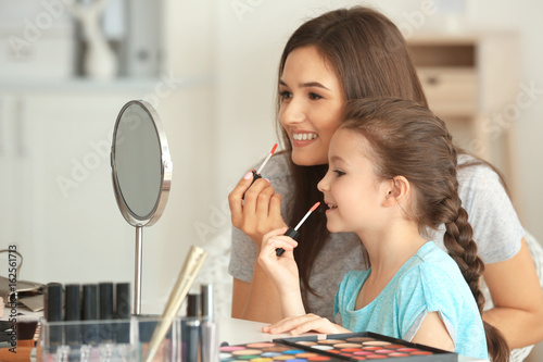 Young woman and her little ...