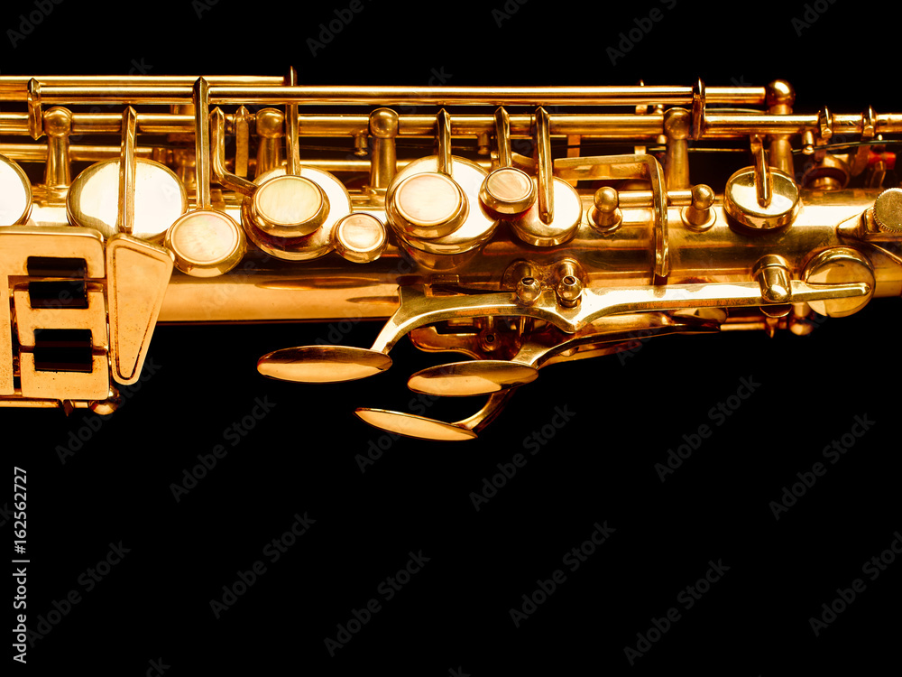 Fototapeta premium Golden saxophone on dark background