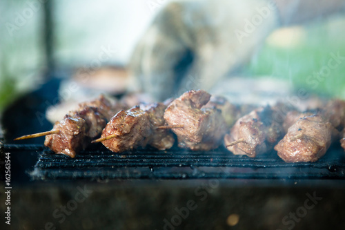 grilled Caucasus barbecue in smoke. Shallow depth of field