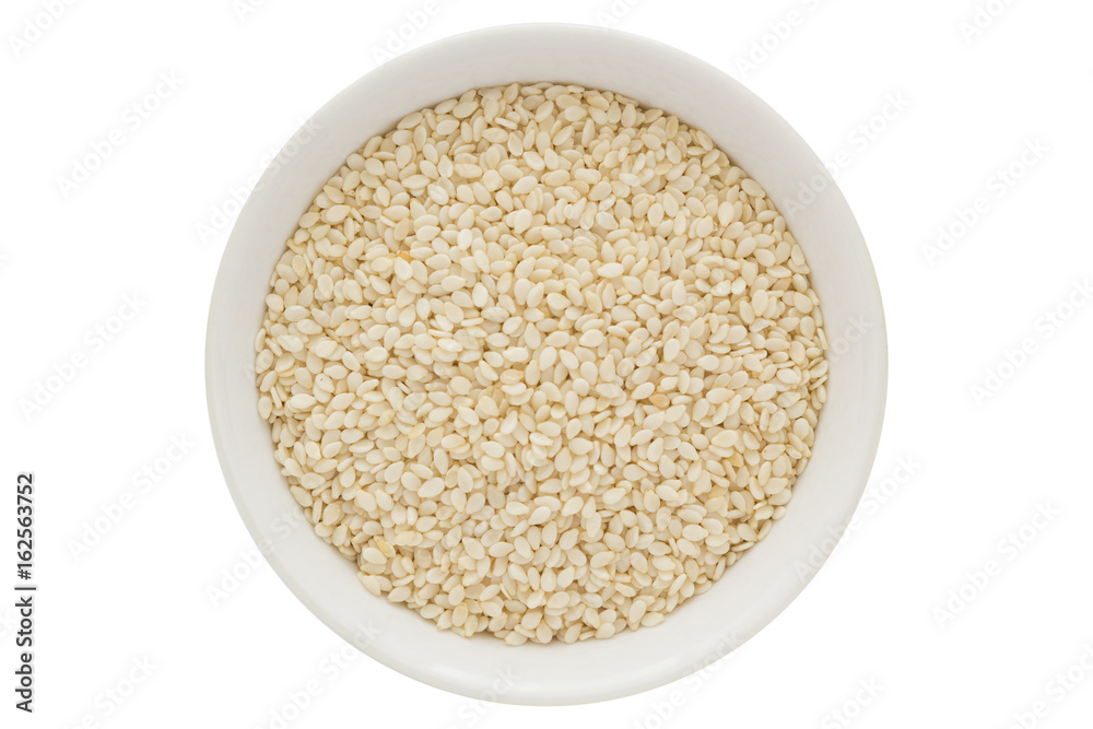 Sesame seeds in white bowl, isolated on white background Sesame seeds in white bowl, isolated on white background