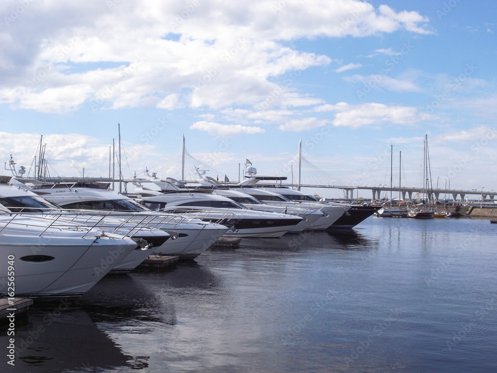 Yachts are on the pier. A clear day, everything is ready for sea walks. Yachts are on the pier. A clear day, everything is ready for sea walks.