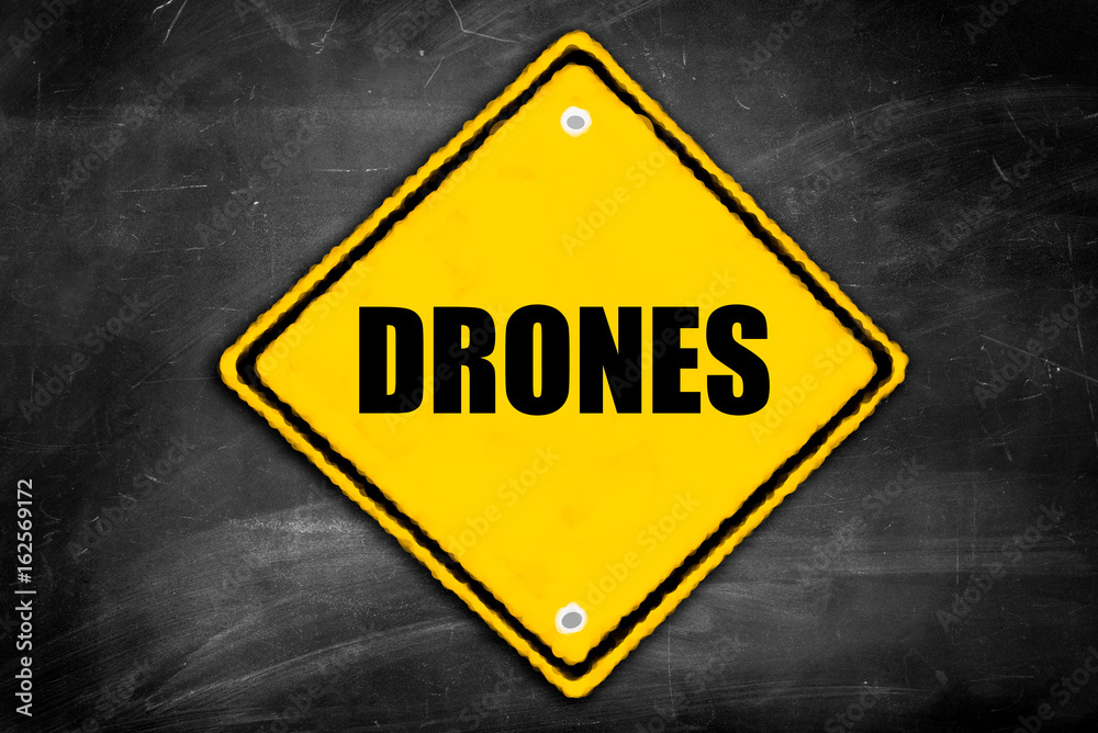 drones written on caution sign drones written on caution sign