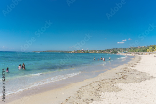 Fototapeta Naklejka Na Ścianę i Meble -  Cienfuegos, Cuba – January 1, 2017: Caribbean beach Playa Rancho Luna in Cienfuegos. Sandy coast