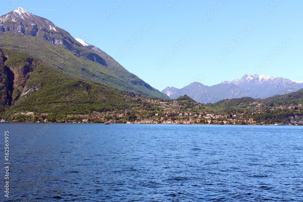 Beautiful little village on the shore of the Como lake near the mountain