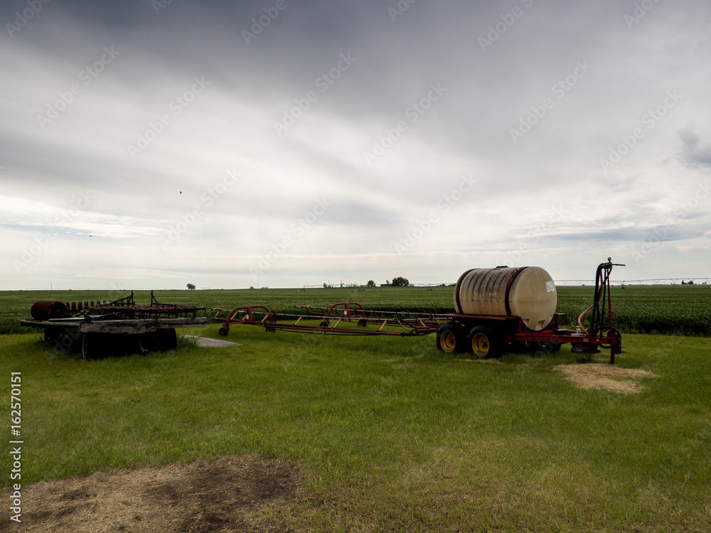 Obraz premium farm water storage barrel and other equipment: 
