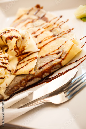 Pancake with ice cream and chocolate sauce