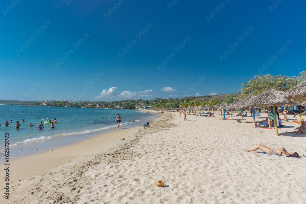 Cienfuegos, Cuba – January 1, 2017: Caribbean beach Playa Rancho Luna in Cienfuegos. Sandy coast