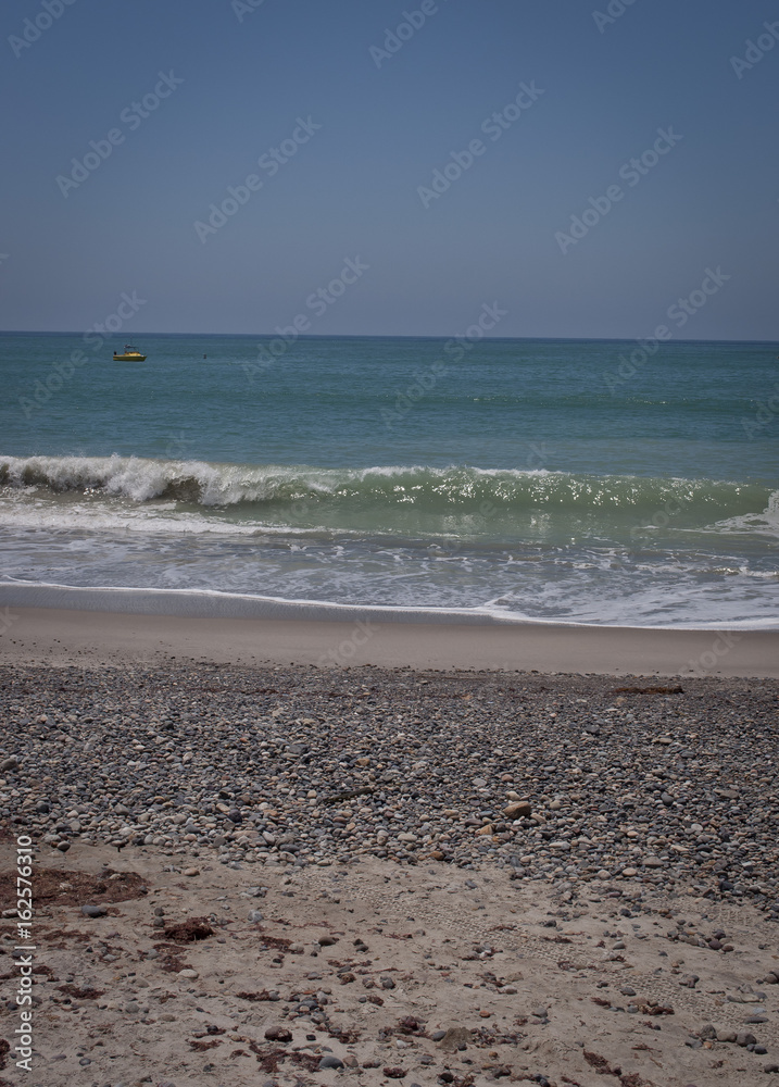 Yellow boat in the Ocean off of Capistrano Beach