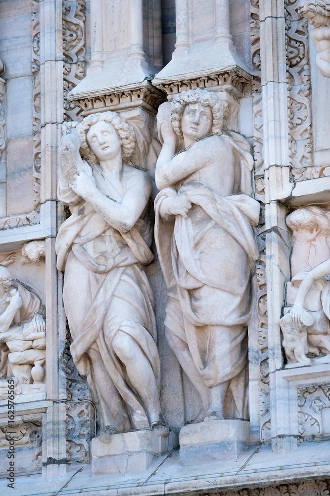 Milan, Italy - June, 19, 2017: sculpturs on a wall of Milan Cathedral, Italy