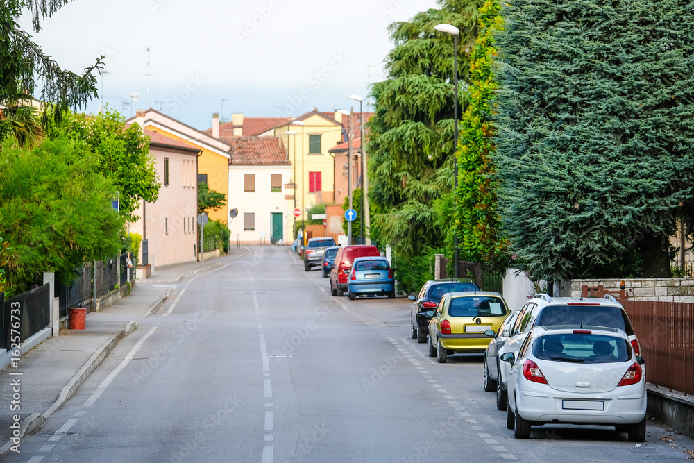 Monselice, Italy - June, 27, 2017: cars parking in a center of Monselice, Italy Monselice, Italy - June, 27, 2017: cars parking in a center of Monselice, Italy
