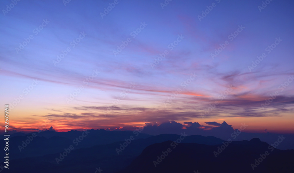 Amazing colorful sunrise in the mountains. Veiw from the Adam's Peak, Sri Lanka