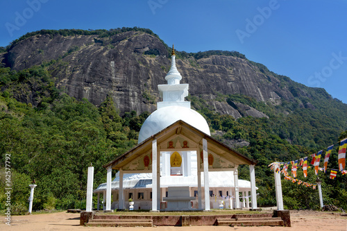 Beautiful white buddhist stupa on the way to Adam's Peak, Sri Lanka