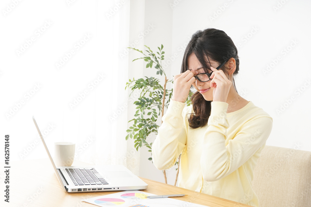 Young woman being be fatigued with office work Young woman being be fatigued with office work