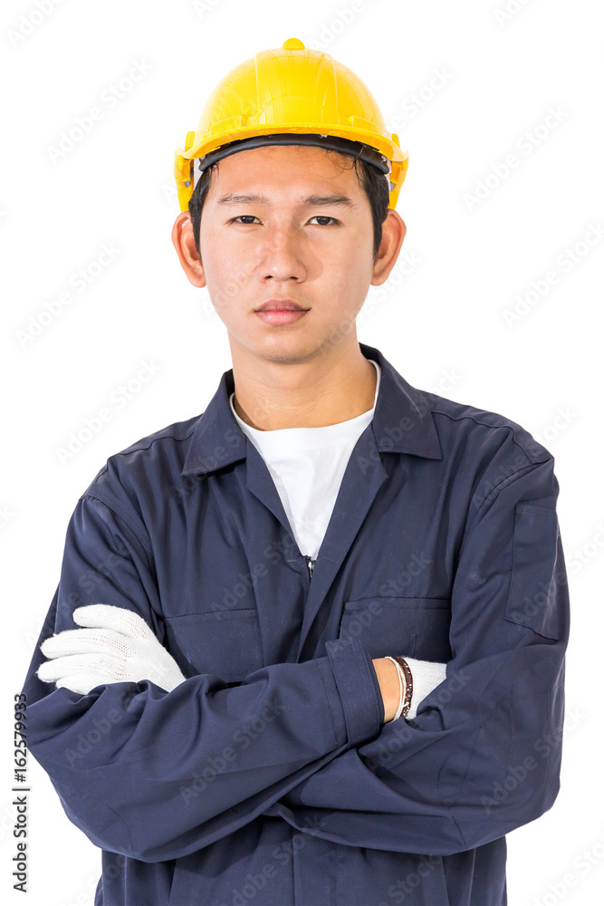 Young worker standing with arm crossed Young worker standing with arm crossed