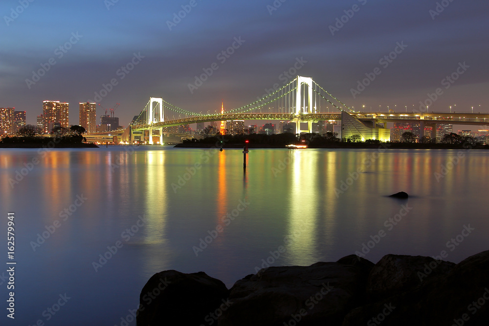 Beautiful scenery during  night time at Tokyo Waterfront night view Rainbow Bridge in Japan. This landmark is a very popular for photographers and tourists. Travel and transportation Concept