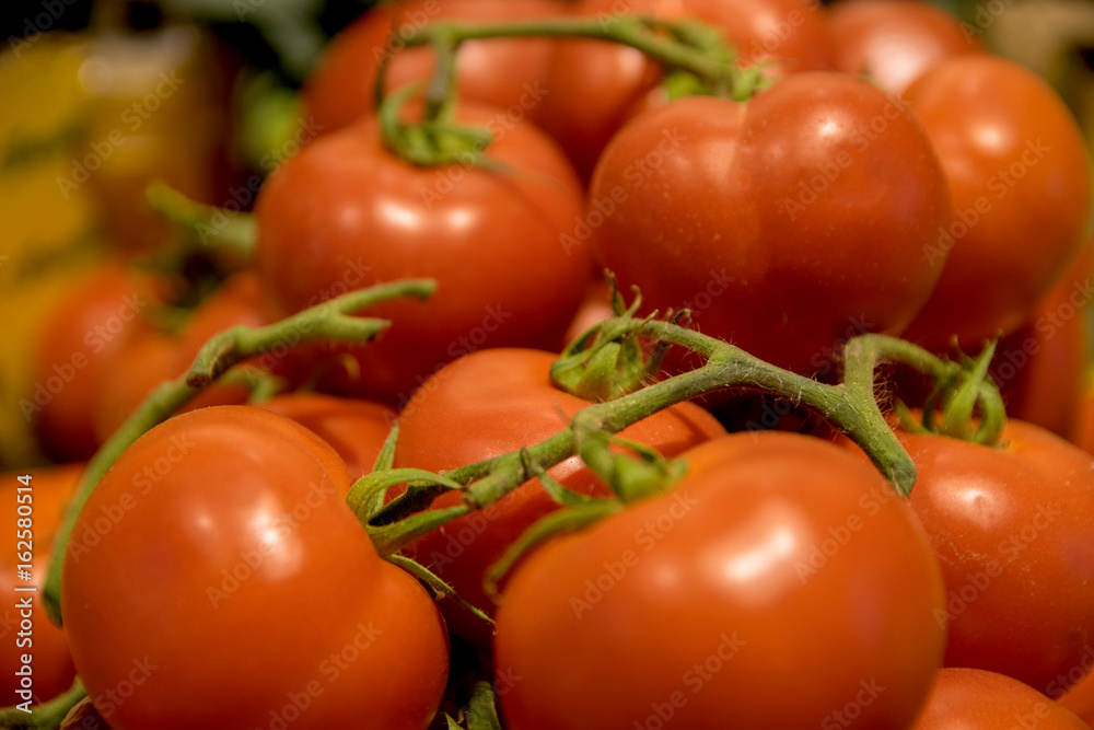 Fresh organic tomatoes as background. Close up