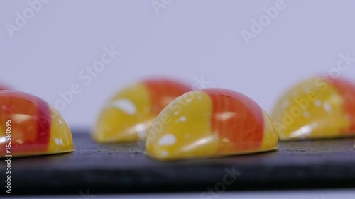 shiny caramel candies. Caramel candies. Row of color caramel candies isolated on a white background. photo