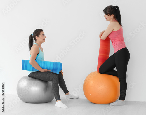Women with stretch mats for...