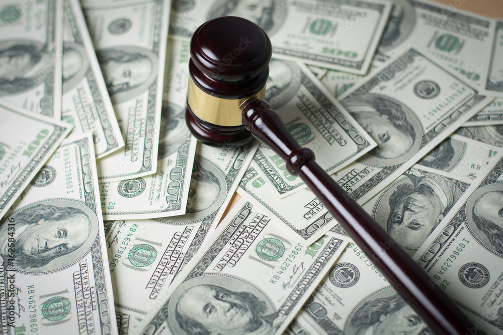 Concept of Legal court gavel on assorted cash, Close up. Concept of Legal court gavel on assorted cash, Close up.
