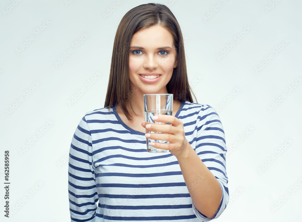 Smiling girl with dental braces drinking water Smiling girl with dental braces drinking water