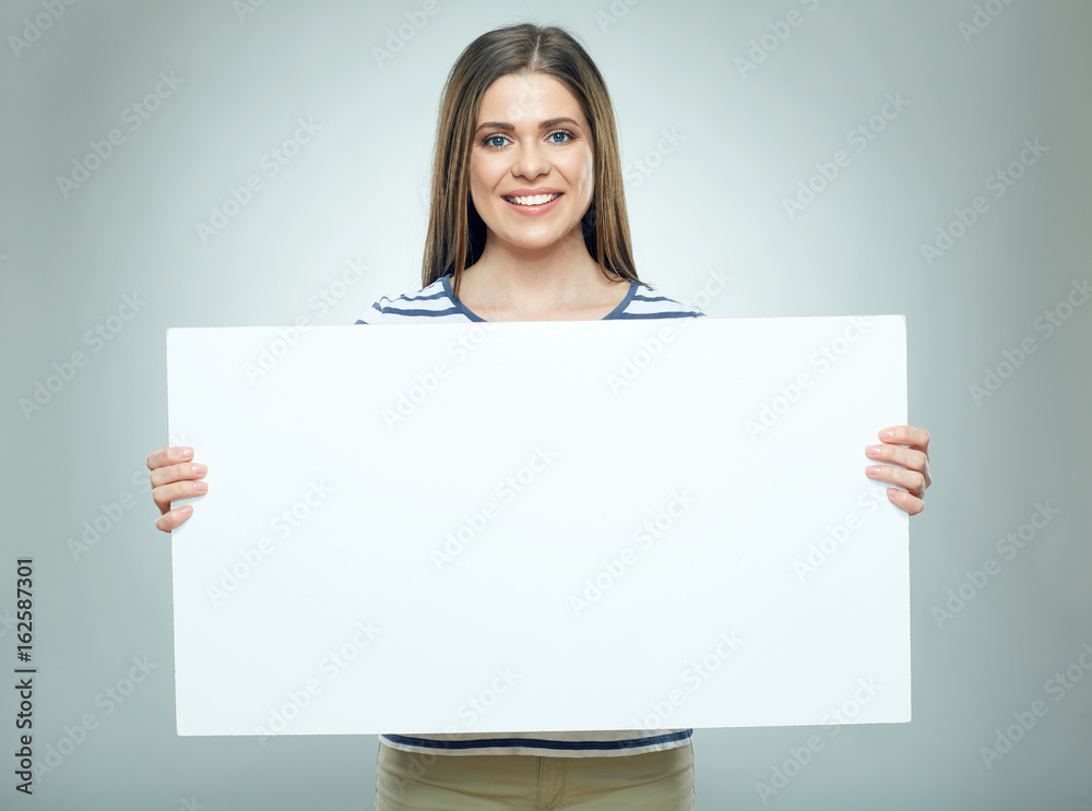 Smiling woman holding white banner wearin striped. Smiling woman holding white banner wearin striped.