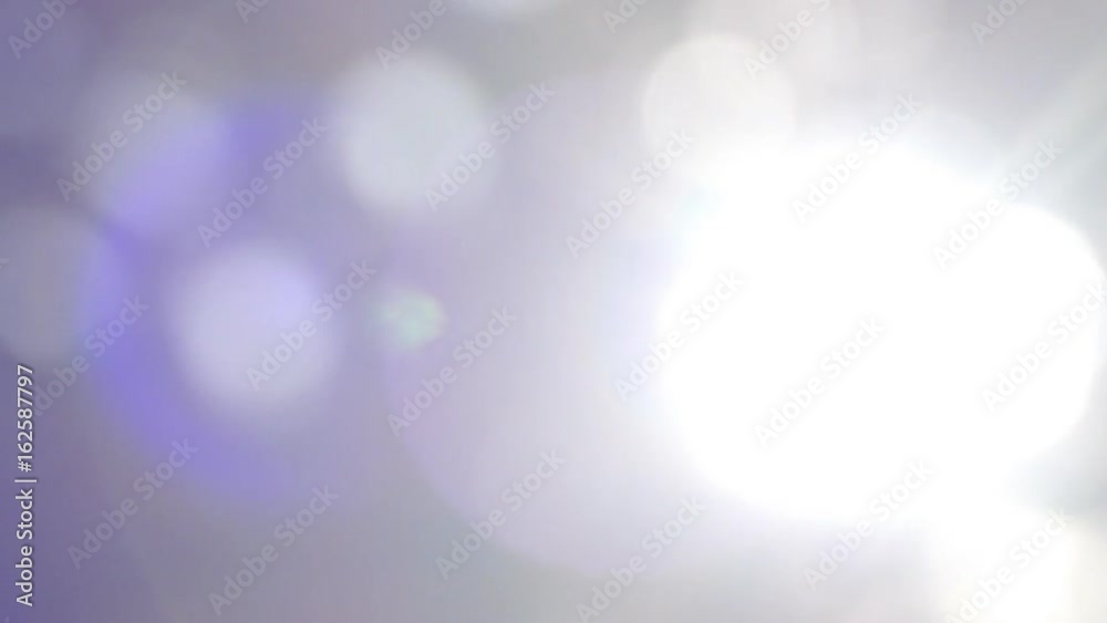 Beautiful green nature background.Blurred abstract bokeh with sun flare