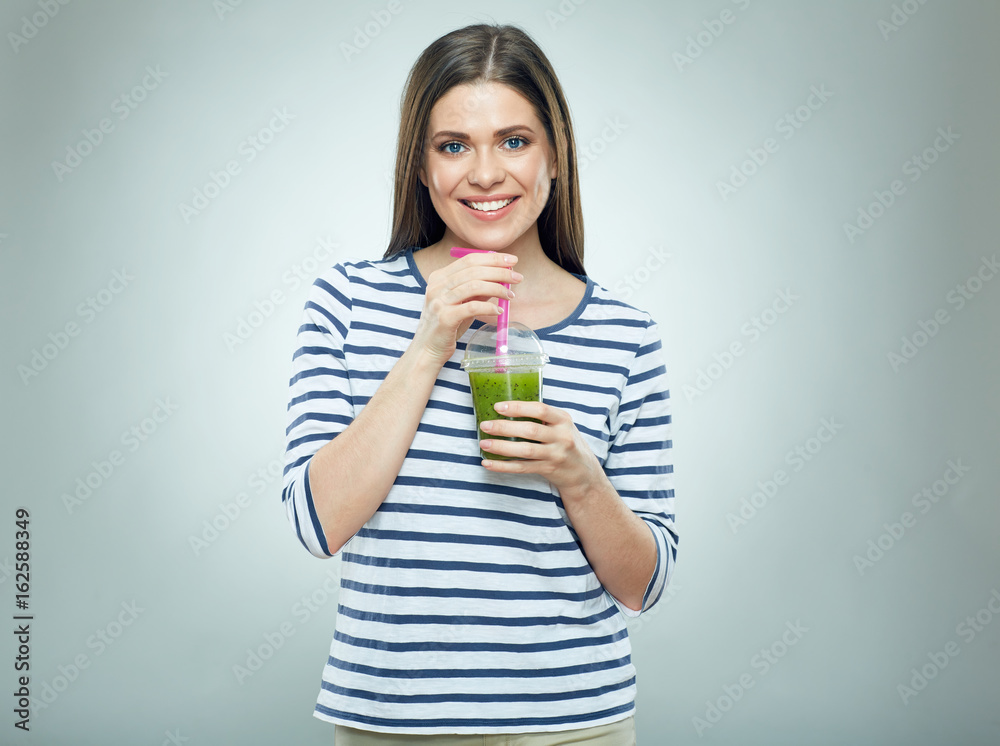 Young woman drinking smoothie drink. Young woman drinking smoothie drink.